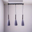 A trio of grey pendant lights suspended from a black rectangular ceiling mount.
