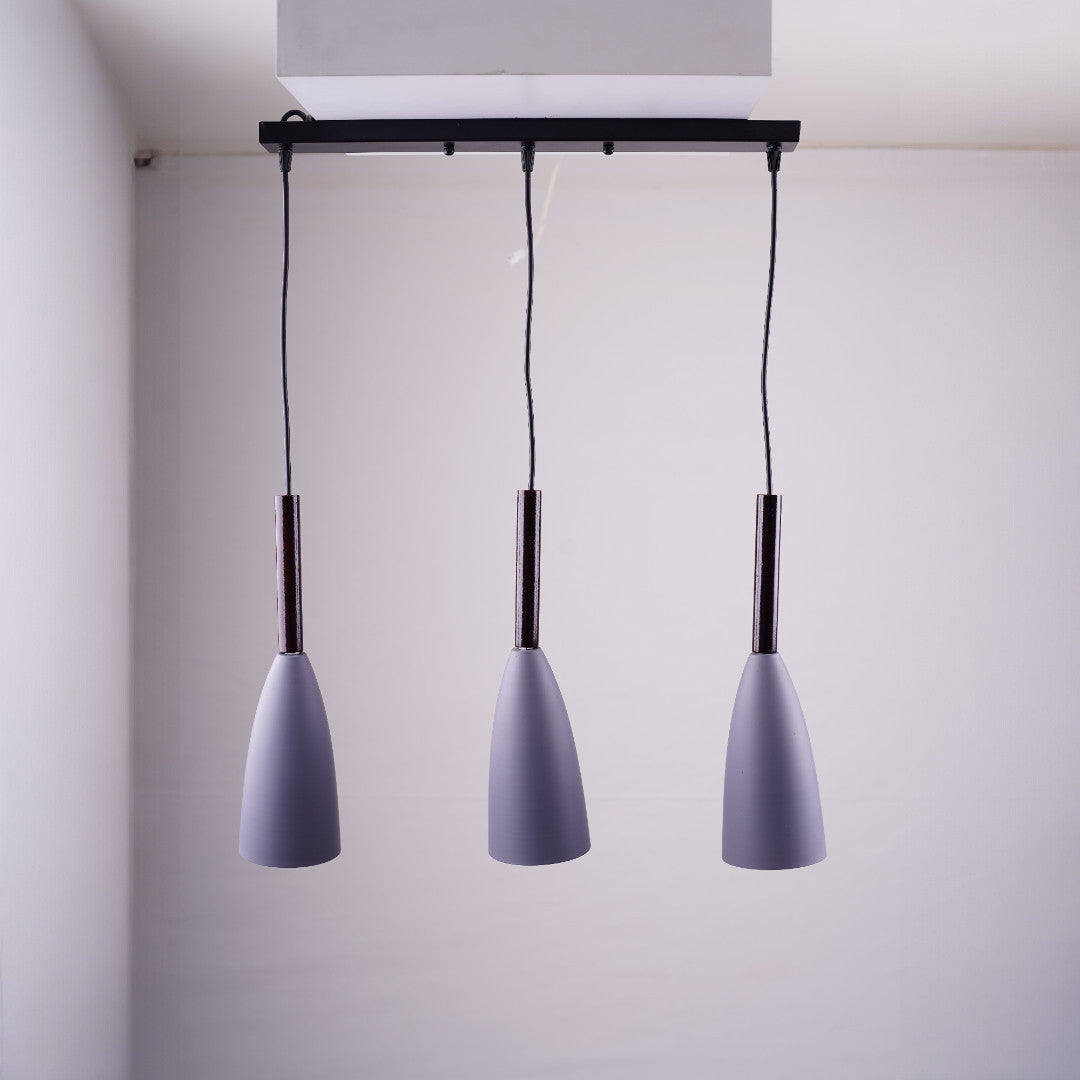 A trio of grey pendant lights suspended from a black rectangular ceiling mount.
