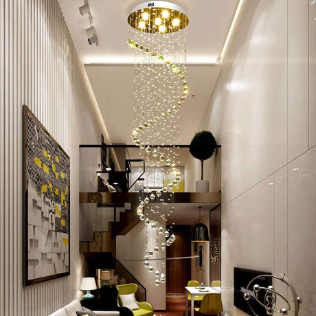 Helical chandelier with cascading crystal balls and soft LED lights in a modern two-story apartment.