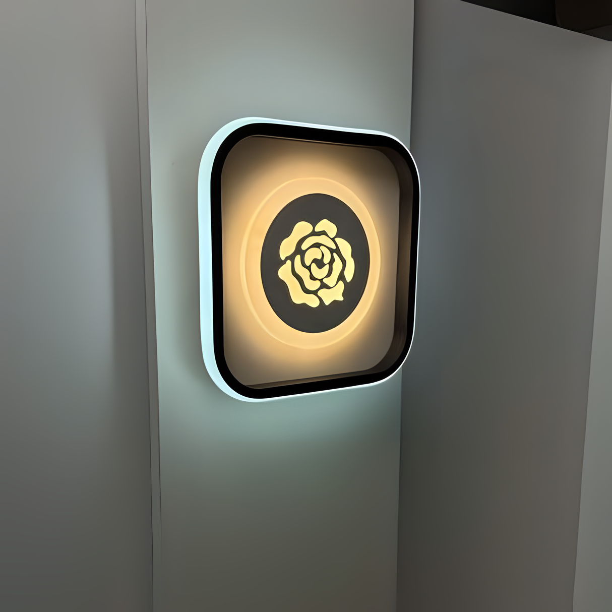 Modern square LED wall light with rose-shaped design and warm glow