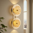 Decorative wall lights with a modern design in a room with a window.