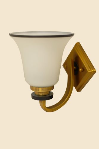 A traditional-style metal wall sconce with a frosted glass shade and black trim, mounted on a gold-colored base.