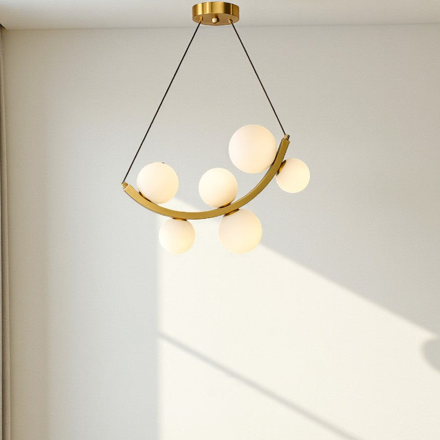 Modern pendant light fixture hanging above a sofa in a living room.
