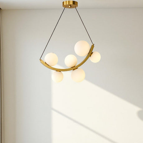 Modern pendant light fixture hanging above a sofa in a living room.